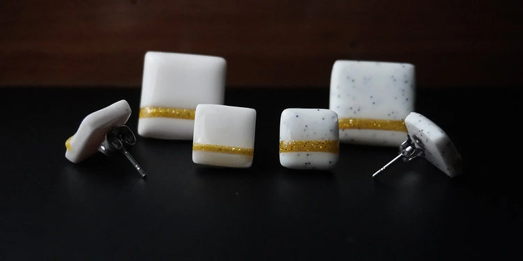 The Line Kollektion Ohrringe weiß mit goldener Linie