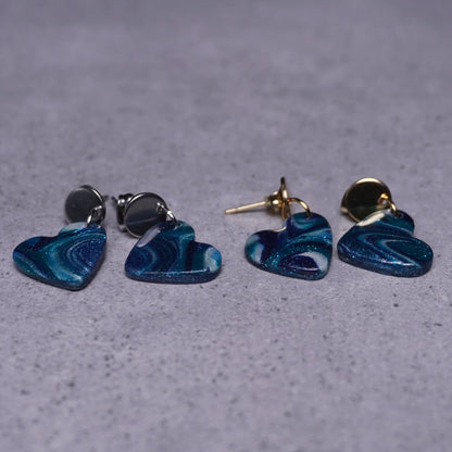 Grünliche Herz-Ohrringe (Galaxy) silberfarben & goldfarben liegend