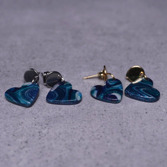 Grünliche Herz-Ohrringe (Galaxy) silberfarben & goldfarben liegend