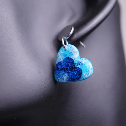 Glitzernde Herz-Ohrringe (Sea Snow)
silberfarben angesteckt